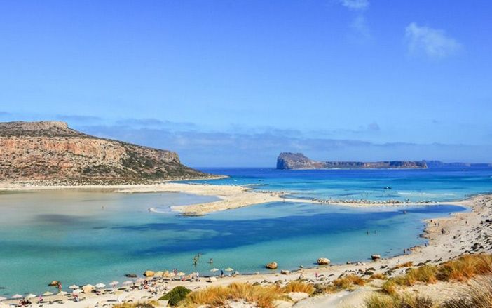 View of Balos lagoon with its magical waters and the island of Gramvousa in Crete