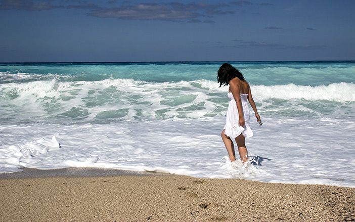 Girl in the sandy beach of Iraklia
