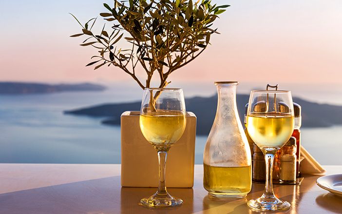 Wine tasting in Santorini island with the view of Thirassia